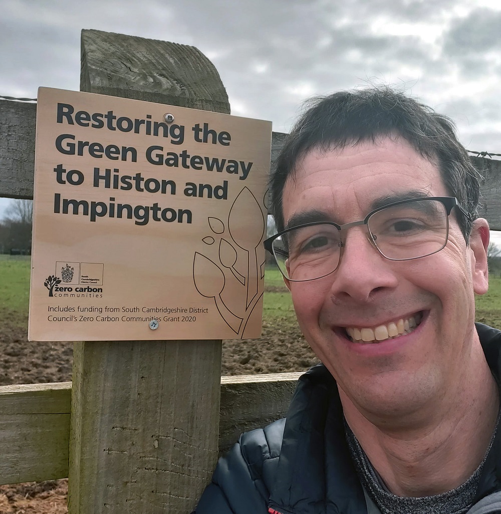 Photo of Dan next to Green Gateway sign