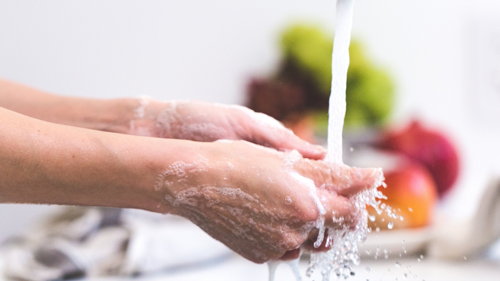 Photo of a person washing their hands