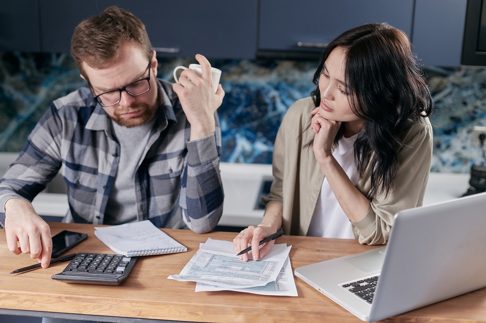 Photo of a couple looking at their bills