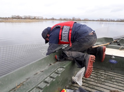 Photo of a floating fence being installed