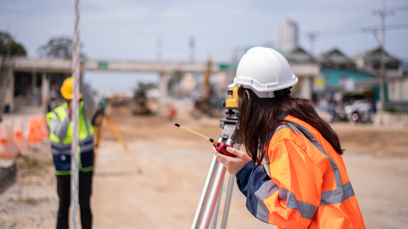Surveyor on construction site